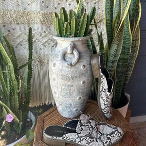 Snake print slip-on mules with a 1" heel